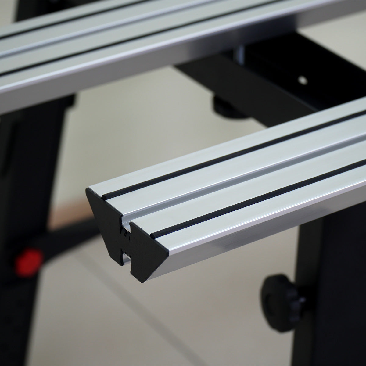 Metal track or guide rail system on a blurred background
